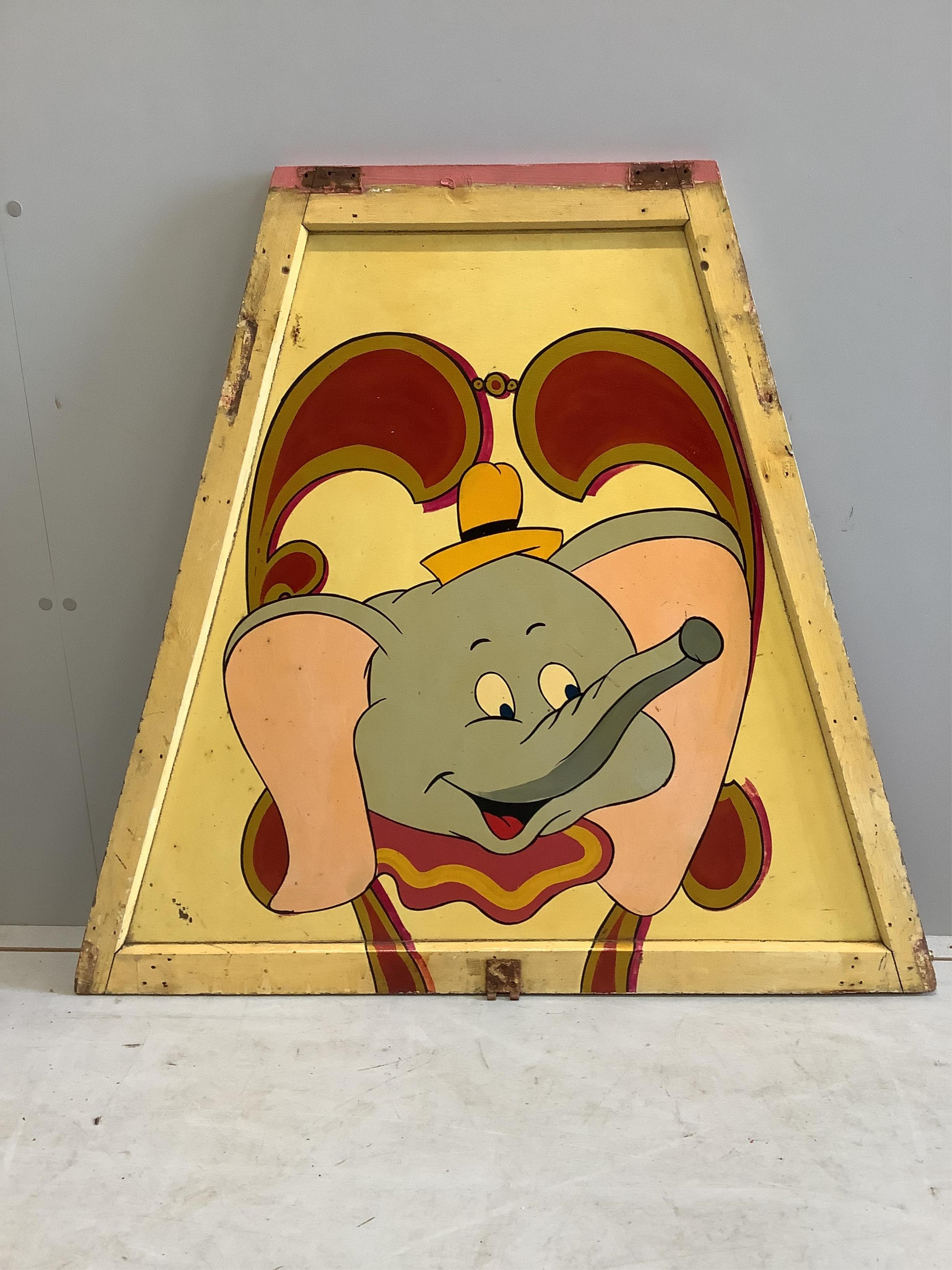 A mid century “Dumbo” painted wood fairground carousel panel of tapered rectangular form, width 104cm, height 94cm. Condition - fair